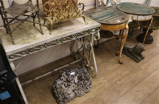 A pair of early 20th century cast iron garden tables, with later wooden tops, and a wrought iron marble top garden table diameter 59cm